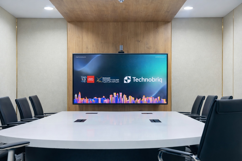 Technobriq enterprise digital signage system in a modern corporate meeting room